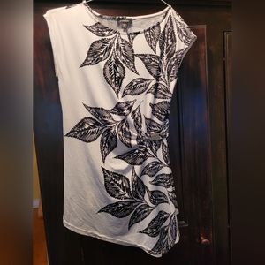 Le Chateau white top with black floral design and silver side buckle, XXS